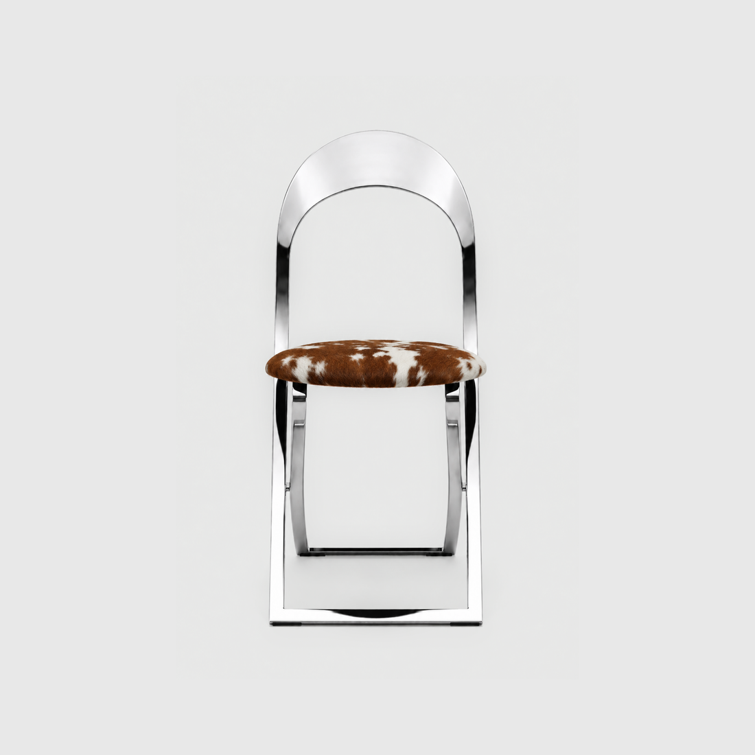 New Piece Luna Dining Chair with chrome frame and Guernsey cowhide upholstery